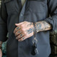 Leather wristlet for men shown worn with everyday outfit