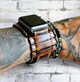 The Outrider 2 inch wide leather Apple Watch cuff, shown on wrist with Apple Watch face