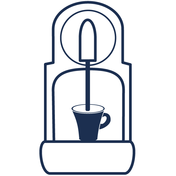 coffee poured from a coffee machine into a small mug
