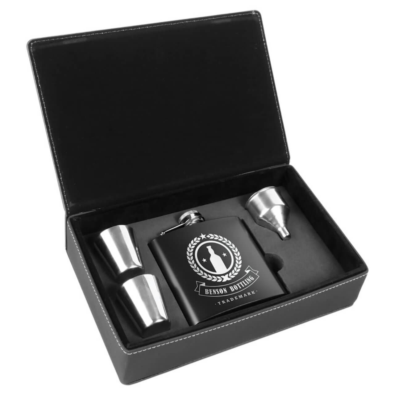 Elevate gifting occasions with our premium 6 oz customizable stainless steel flask gift set, featuring a sleek black matte flask with custom engraving options, two polished stainless steel shot glasses, and a convenient stainless steel funnel, all nestled in a luxurious black leatherette presentation box for ultimate sophistication and portability. This personalized hip flask set is the perfect reusable whiskey flask gift for groomsmen, weddings, birthdays, or corporate events, offering leak-proof durability, BPA-free construction, and timeless style.