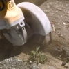 Cutting through asphalt or concrete slab with 4-inch diamond blade