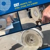 The HDII 4.5" flange cutting granite, tile, steel, stone, and pvc