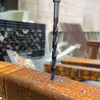 Cobalt bit drilling through thick, rusted angle iron