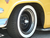 5 lug Spider Hub Cover on a vintage car with trim ring.