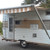 Vintage travel trailer with cone moon hubcaps