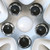 Close-up of nuts that screw down on the outside threads of the factory lug nuts just like genuine  Impala hubcaps.