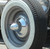 Vintage Tall Bullet Center Cap Shown on a Rat Rod Close-up