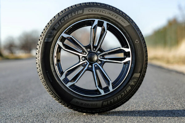 Michelin CrossClimate2 tire in the middle of the road, sidewall view