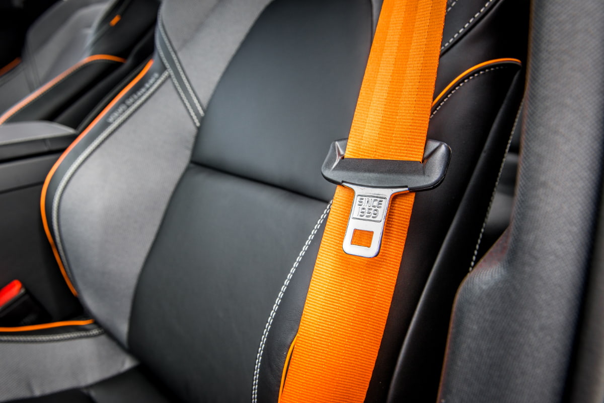 Close-up of a car seatbelt, since 1959: Vehicle safety features over time