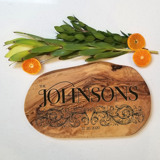 Baroque style charcuterie board in olive wood