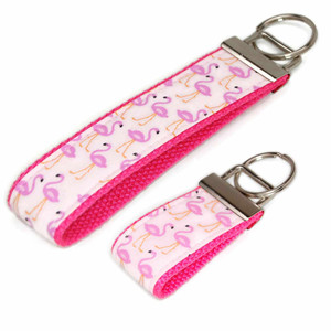 pink flamingo keychain in both the mini and wristlet size pink flamingo keychain in both the mini and wristlet size