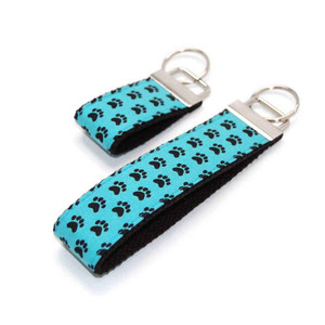 aqua & black paw keychain silver hardware in both wristlet and mini size aqua & black paw keychain silver hardware in both wristlet and mini size