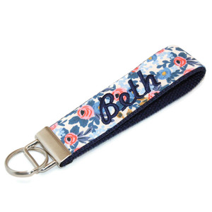 this is a picture of floral coral keychain with name this is a picture of floral coral keychain with name
