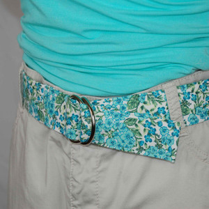 mint and turquoise floral fabric belt on a mannequin  mint and turquoise floral fabric belt on a mannequin