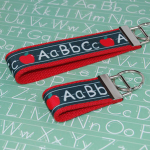 alphabet on chalkboard keychain silver hardware in both wristlet and mini size alphabet on chalkboard keychain silver hardware in both wristlet and mini size