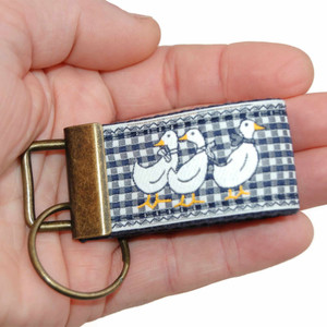 vintage duck on navy gingham keychain in hand mini version vintage duck on navy gingham keychain in hand mini version