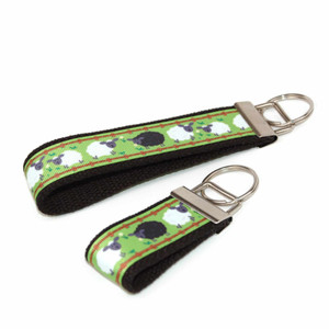 sheep on green keychain silver hardware in both wristlet and mini size sheep on green keychain silver hardware in both wristlet and mini size
