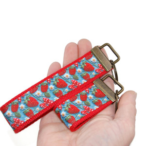 strawberry keychain in hand wristlet and mini version