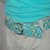 mint and turquoise floral fabric belt on a mannequin  mint and turquoise floral fabric belt on a mannequin