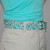 mint and turquoise floral fabric belt up close  mint and turquoise floral fabric belt up close