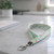mint floral fabric lanyard on counter