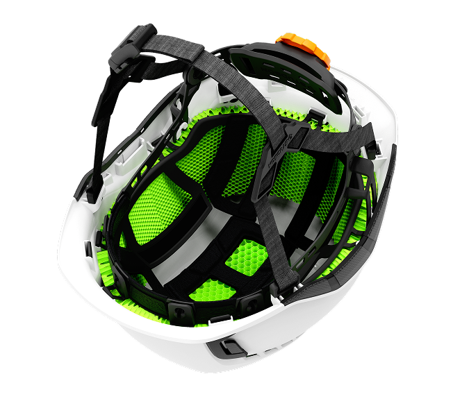 Inside of the Studson SHK-2 helmet showing the green Koroyd tube liner, retention arms and 4-point chinstrap