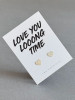 Sterling silver heart earrings on a ' Love You Long Time' message card.
