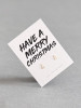 Sterling silver tree earrings on a 'Have A Merry Christmas' message card.