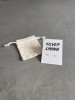 Sterling silver cloud earrings on a 'Silver Lining' message card. The earrings are shown with a personalised gift bag.