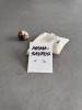 Sterling silver dinosaur earrings on a 'Mama-saurus' message card. The earrings are shown with a personalised gift bag.