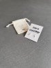 Sterling silver lightning bolt earrings on a ' She's Electric' message card. The earrings are inspired by the Oasis tour in summer 20025.