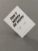 Sterling silver bee earrings on a 'Don't Worry Be Happy' message card.