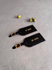 Real leather luggage tags with gold coloured detailing and gold emboss. The luggage tags are shown next to some olives.