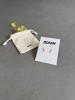 Sterling silver climbing flower stud earrings on a 'Bloom' message card. The earrings are shown with a Wue gift bag.