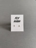 Sterling silver airplane earrings on a 'Fly High' message card.