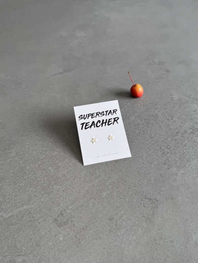 Sterling silver star earrings on a 'Superstar Teacher' message card. Sterling silver star earrings on a 'Superstar Teacher' message card.