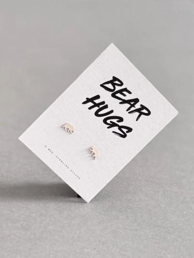 Sterling silver bear earrings on a 'Bear Hugs' message card. Sterling silver bear earrings on a 'Bear Hugs' message card.