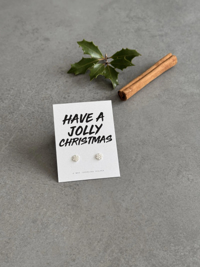 Sterling silver snowflake earrings on a 'Have A Jolly Christmas' message card. Sterling silver snowflake earrings on a 'Have A Jolly Christmas' message card.