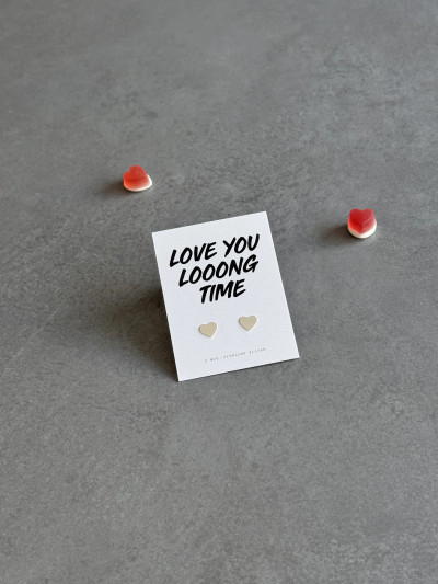 Sterling silver heart earrings on a ' Love You Long Time' message card.