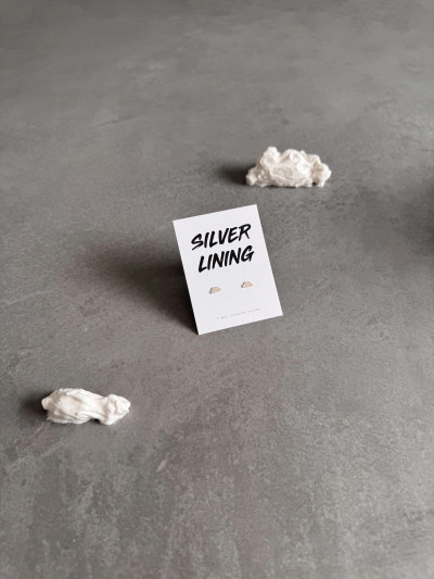 Sterling silver cloud earrings on a 'Silver Lining' message card. Sterling silver cloud earrings on a 'Silver Lining' message card.