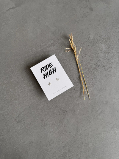Sterling silver horse earrings on a 'Ride High' message card.