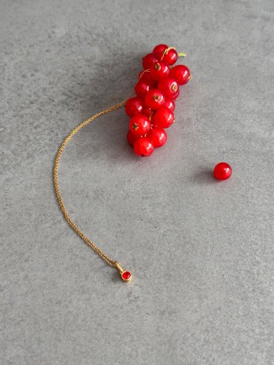 24k gold plated sterling silver July birthstone necklace featuring a 4mm red Ruby Swarovski crystal.