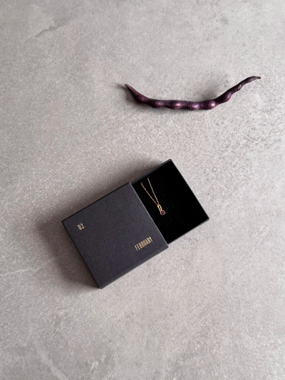 24k gold plated sterling silver February birthstone necklace featuring a 4mm purple Amethyst Swarovski crystal. 24k gold plated sterling silver February birthstone necklace featuring a 4mm purple Amethyst Swarovski crystal.