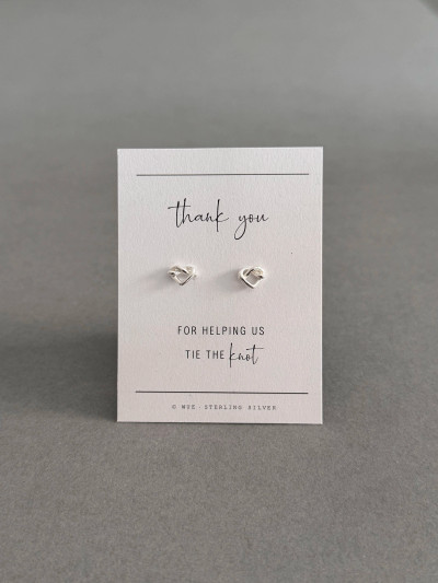 Sterling silver heart knot earrings on 'Thank you' message card. Sterling silver heart knot earrings on 'Thank you' message card.