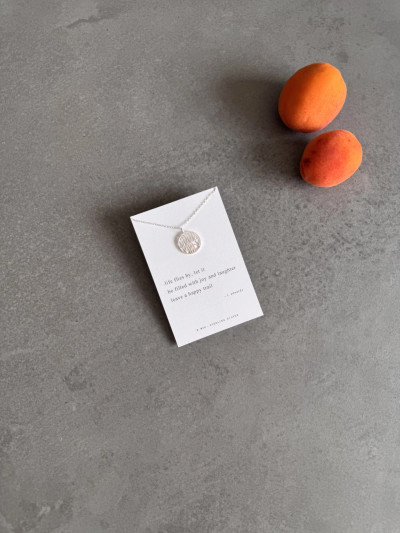 Sterling silver good vibes necklace on a Haiku poem message card. Sterling silver good vibes necklace on a Haiku poem message card.