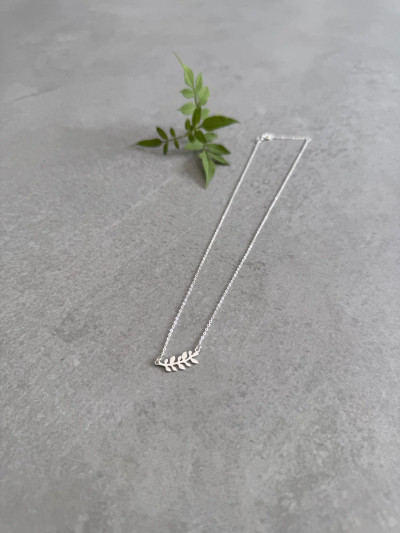 Sterling silver leaf necklace on a 'Bloom' message card. Sterling silver leaf necklace on a 'Bloom' message card.
