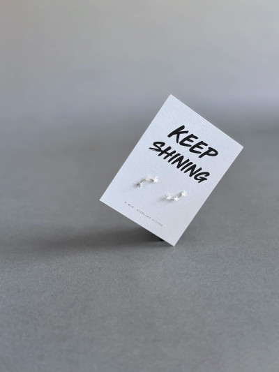 Sterling silver 3 star stud earrings on a 'Keep Shining' message card.