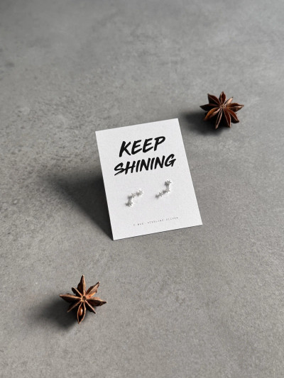 Sterling silver 3 star stud earrings on a 'Keep Shining' message card.