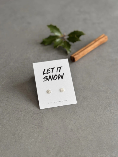 Sterling silver snowflake earrings on a 'Let It Snow' message card. Sterling silver snowflake earrings on a 'Let It Snow' message card.