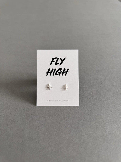 Sterling silver airplane earrings on a 'Fly High' message card. Sterling silver airplane earrings on a 'Fly High' message card.